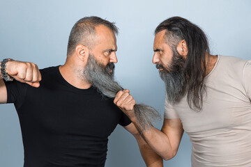 men with long beard in aggressive attitude.