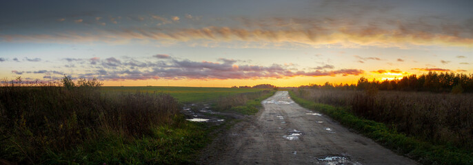 Large-format panorama with a country road at dusk