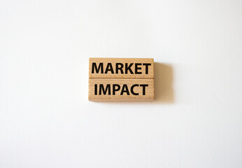 Market impact. Concept word Market impact on wooden cubes. Beautiful white background. Business and Market impact concept. Copy space.