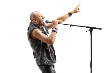 Profile shot of a rock star singer singing on a microphone