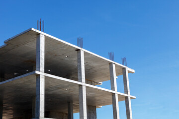 Reinforced concrete frame of a building under construction - obrazy, fototapety, plakaty