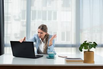 Frustrated annoyed woman confused by computer problem, annoyed businesswoman feels indignant about...