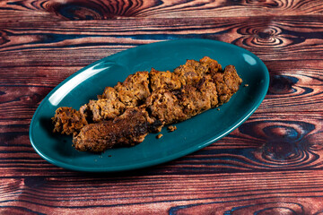 spicy bbq chicken seekh kabab served in a dish isolated on background top view