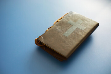 Book with the symbol of the cross. Bible study. Religious book. Prayer.