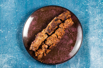 spicy bbq chicken seekh kabab served in a dish isolated on background top view