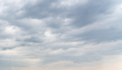 Smooth rows of gray clouds block out the sunlight
