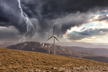Wind turbines on a beautiful sky.A mountain wind farm in Italy. Renewable energy concept, green...