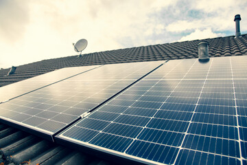 solar panels on the roof. close-up of solar panels on cloudy sky, Overcast. bad weather. 