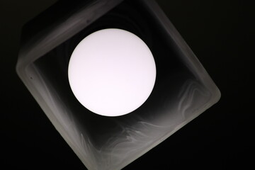 A white bulb in a beautiful plafond