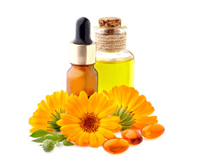 Vitamin capsules with calendula flowers and oil.