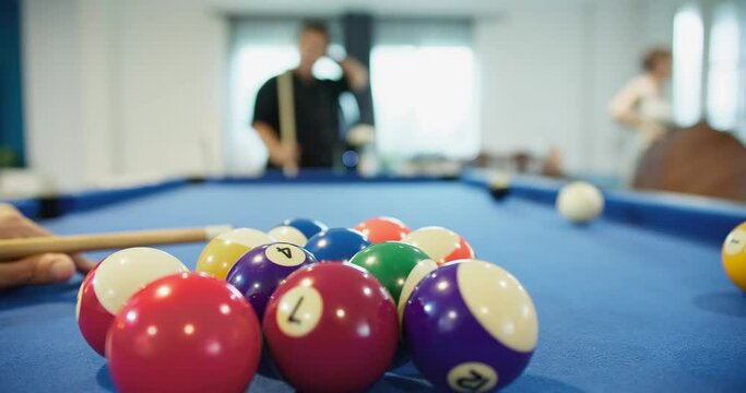 Close up shot of sport game player play billiard pool snooker ball cue with number on the table at entertainment club, leisure competition recreation hobby activity and fun	