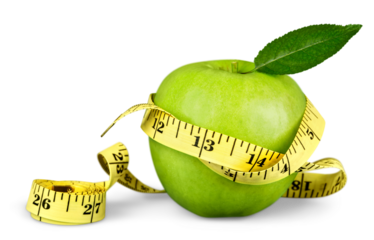 Fresh green apple and tape measure isolated on white background