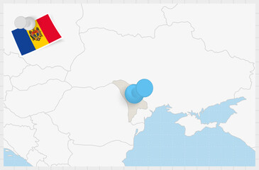 Map of Moldova with a pinned blue pin. Pinned flag of Moldova.