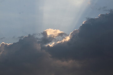 Dramatic cloud sunset time with sunbeams