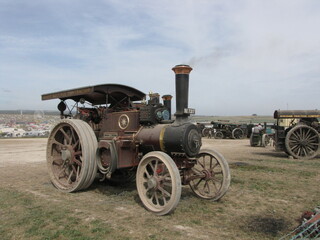 Fototapeta na wymiar a beautiful steam engine at the hill at the great dorset steam fair in england in summer