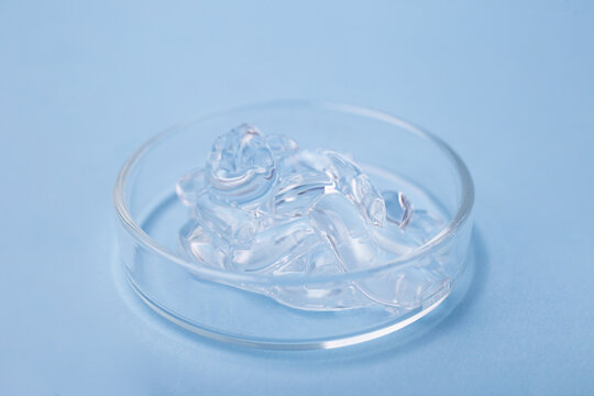 Closeup photography of cosmetic gel with bybbly structure in petri dish.