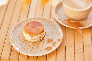 Fototapeta premium Vegetarian healthy no baking and no sugar carrot dessert with agave syrup. Gluten free cake with cup of coffee