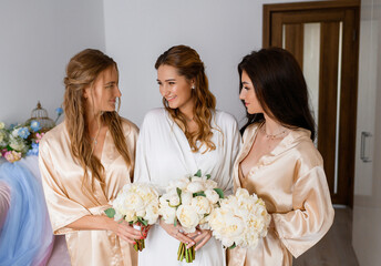 Bride With Bridesmaids Holding Wedding Bouquets