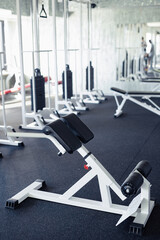 Fototapeta na wymiar Vertical image of sport equipments for physical exercises in health club
