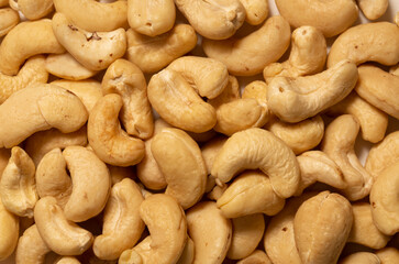 Cashew nuts as a background, top view. Cashew isolated on white background. Healthy foods.