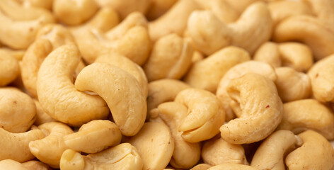Cashew nuts as a background, top view. Cashew isolated on white background. Healthy foods.