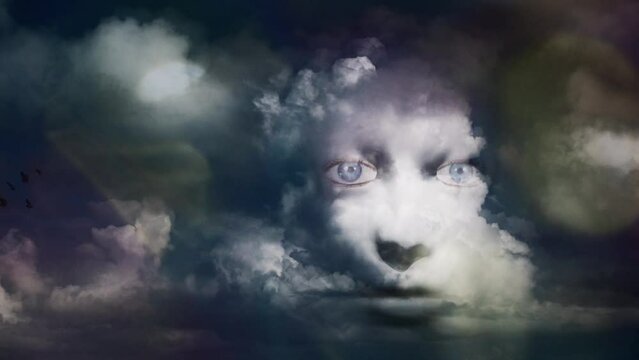 Mystic woman's face in the cloudy sky