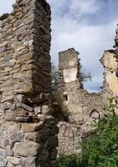 stone built walls and ruined buildings in an abandoned Spanish Pyrenees village 