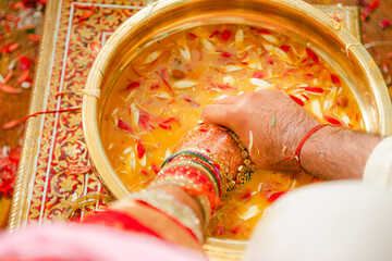 Bride and Groom playing find the ring game in south indian wedding ceremony