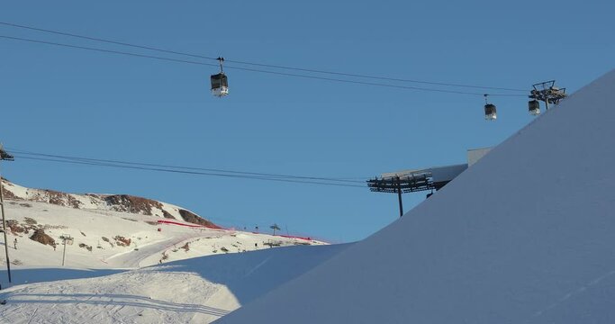Ski lift cabin in snowy mountain landscape
