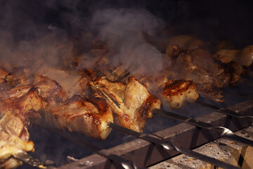 Steaming juicy pieces of pork on the grill. Pork kebab. Shallow depth of field