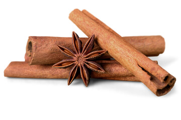 Cinnamon sticks and star anise on white background isolated