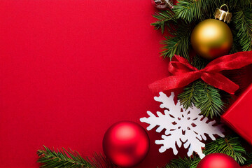 christmas background with red balls and fir branches gift and present boxes