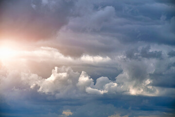 Breaking sunlight through gap of storm clouds.