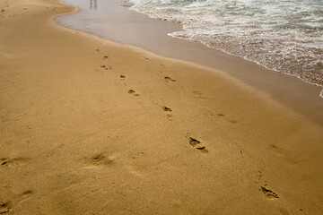People enjoying their time on the beach in Carcavelos, Portugal