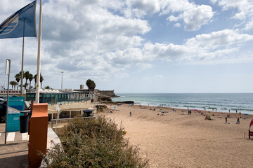 Naklejka premium People enjoying their time on the beach in Carcavelos, Portugal