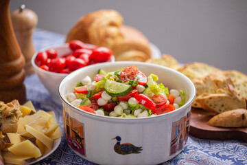 Fresh lettuce macro shot. Salad with baby mozzarella cherry leaves iceberg. Olive oil in salad. Salad with drops of oil on vegetables. Cucumber close-up. Fresh vegetables in a salad
Сucumber in 