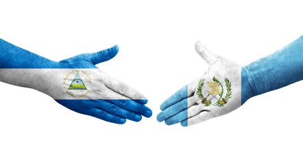 Handshake between Guatemala and Nicaragua flags painted on hands, isolated transparent image.