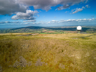 Titterstone Clee Hill Summit with NATS radar Station. In the distance is Brown Clee Hill