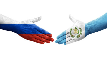 Handshake between Guatemala and Russia flags painted on hands, isolated transparent image.