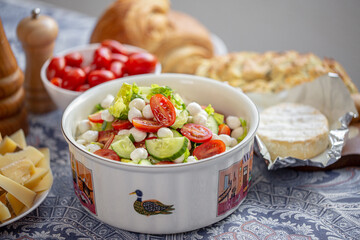 Summer salad. Fresh salad with mozzarella. Lettuce with cherry tomatoes, cucumbers and mozzarella. Bebe mozzarella. Diet salad. Vegetarian salad