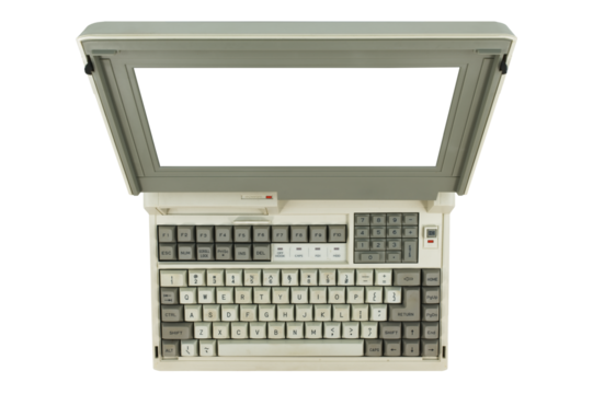 Overhead perspective of vintage laptop computer wiith transparent monitor screen.