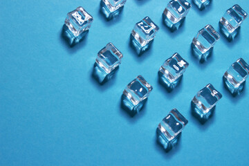 Ice cubes on blue