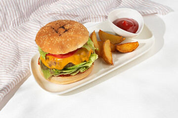 fresh tasty Burger with beef on a white plate.