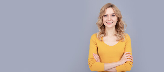 cheerful blonde beauty girl with curly hair, smooth skin. Woman isolated face portrait, banner with mock up copy space.