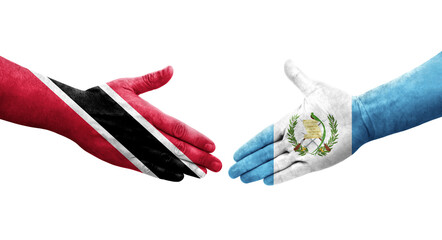 Handshake between Guatemala and Trinidad Tobago flags painted on hands, isolated transparent image.