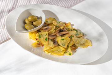 Oven baked potato wedges with cheese and herbs - homemade organic vegetable vegan vegetarian potato wedges snack, top view, copy space.