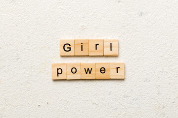 Girl Power word written on wood block. Girl Power text on cement table for your desing, concept