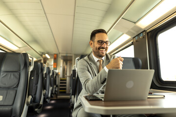 Young business man traveling to work by train, working while traveling, with his laptop and notebook, talking on phone, writing down some goals in notebook.
Business people stock photo
