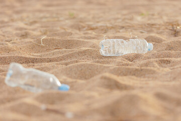 plastic garbage on the beach, environmental pollution. climate change and global warming. volunteers collect plastic bottles. recycling, products without eco trace. taking care of the environment