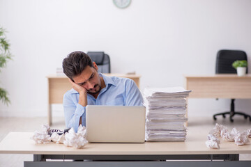 Young male employee rejecting new ideas in the office
